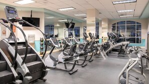 A gym with multiple treadmills, ellipticals, and weight machines. - One Mile From Vegas Strip-Dazzling Vegas Views - Wyndham Grand Desert-2 Bd. Dlx. (Las Vegas)