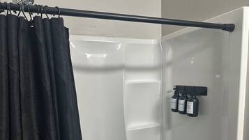 Shower, hair dryer, towels, shampoo