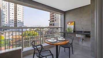 Apartamento | Restaurante al aire libre