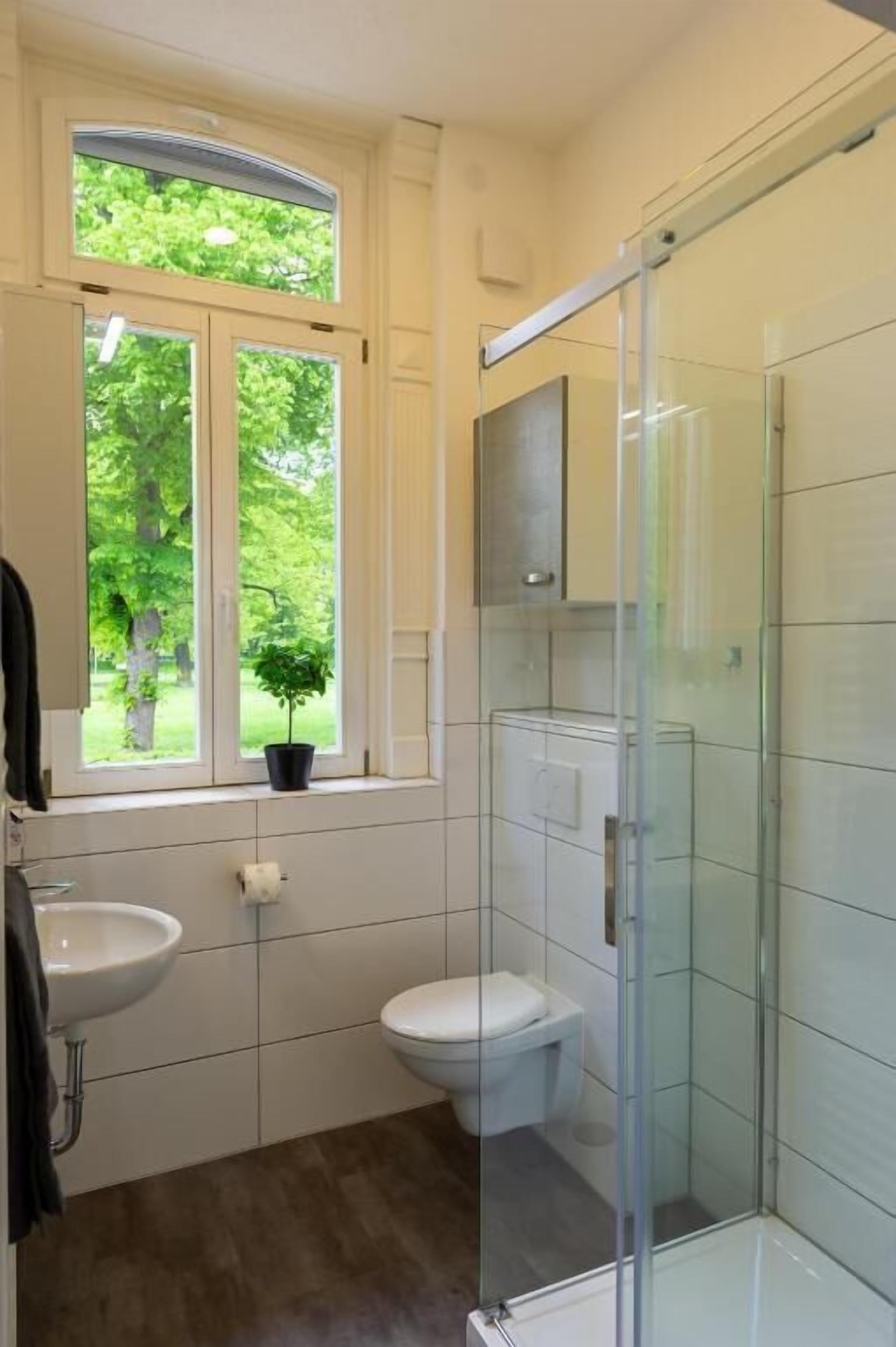 Shower, rainfall showerhead, hair dryer, towels