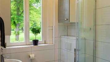 Shower, rainfall showerhead, hair dryer, towels