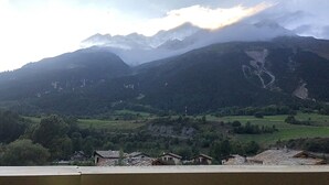 A mountainous landscape with a village in the valley. - Terrasses F 102 - PARC NAT. VANOISE appart. 4 pers (Val Cenis)