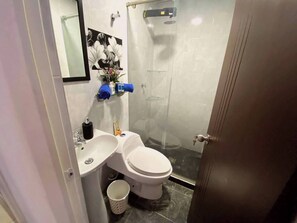 Shower, hair dryer, towels, soap