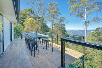 Enjoy warm afternoons on the expansive outdoor deck that features a BBQ and alfresco dining table