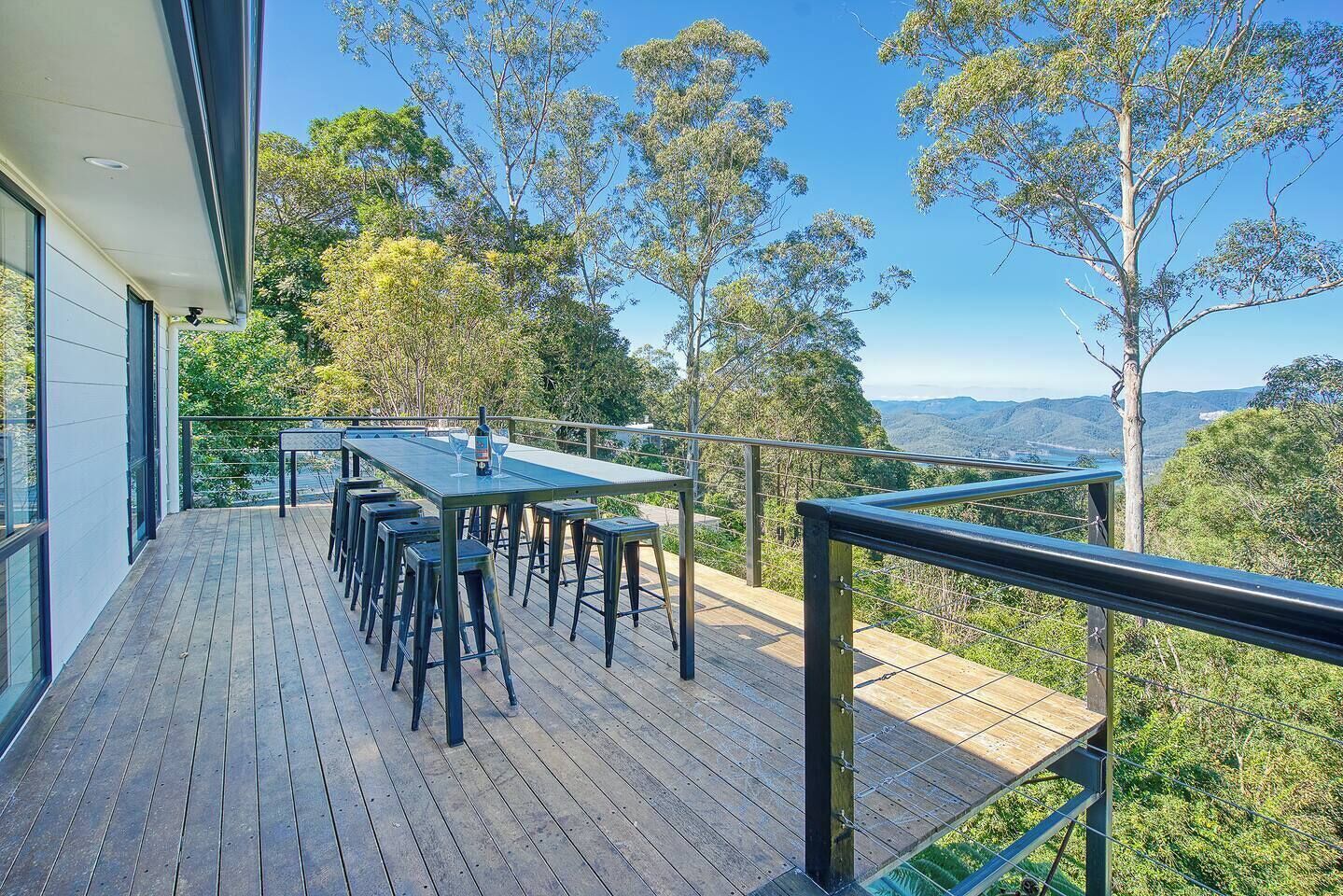 Enjoy warm afternoons on the expansive outdoor deck that features a BBQ and alfresco dining table
