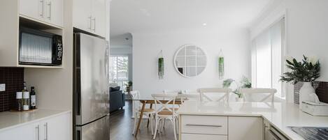 Dishwasher, coffee/tea maker, dining tables