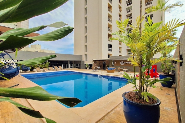 Outdoor pool, open 6:00 AM to 10:00 PM, pool umbrellas, sun loungers