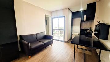 Deluxe Apartment | Living area | 34-inch flat-screen TV with digital channels, pay films