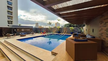 Outdoor pool, open 6:00 AM to 10:00 PM, pool umbrellas, sun loungers