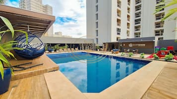 Outdoor pool, open 6:00 AM to 10:00 PM, pool umbrellas, pool loungers