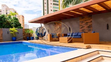 Outdoor pool, open 6:00 AM to 10:00 PM, pool umbrellas, pool loungers