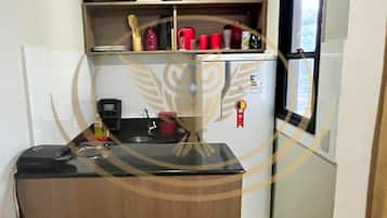 Basic Apartment | Private kitchen | Microwave, cookware/dishes/utensils, dining tables