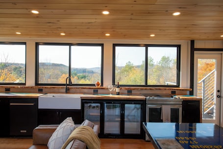 Fridge, microwave, stovetop, dishwasher. Amazing 34 foot high shipping container home in Whitingham on Sadawga Lake