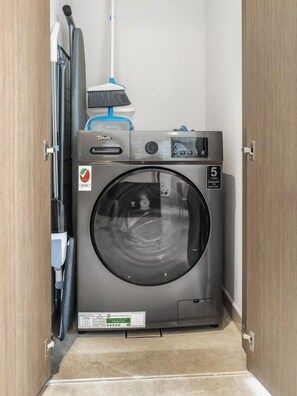 Compact laundry space with essentials