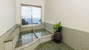 A bathroom with a view of the ocean, a tiled floor, and a potted plant. - Villa FUN Kawana (Ito)