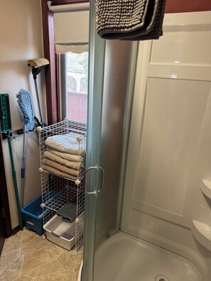 Shower, hair dryer, towels, soap