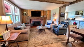 Smart TV, fireplace, books