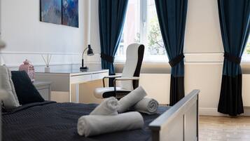 1 bedroom, desk, iron/ironing board, travel crib