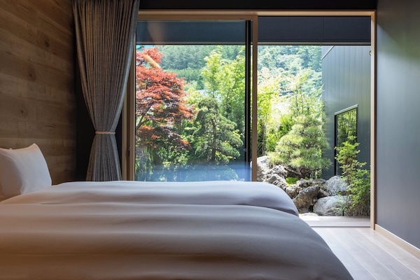 Suite, Multiple Beds, Private Bathroom, Garden View | Soundproofing, free WiFi