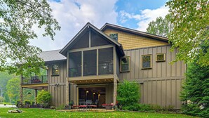 A modern two-story house with a covered patio and a large windowed front porch. - 28 Acres: Home w/ Barn & Fire Pit Near Franklin! (Otto)