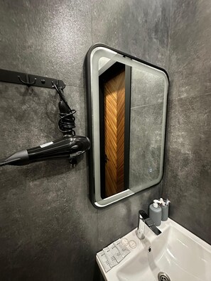 Hair dryer, towels, soap, shampoo