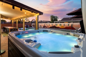 Unwind in the glow of the night! Our hot tub is ready for a relaxing evening soak