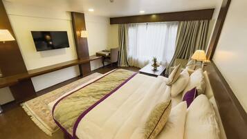 Deluxe Double Room | Minibar, desk, laptop workspace, iron/ironing board