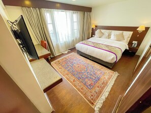 Minibar, desk, laptop workspace, iron/ironing board