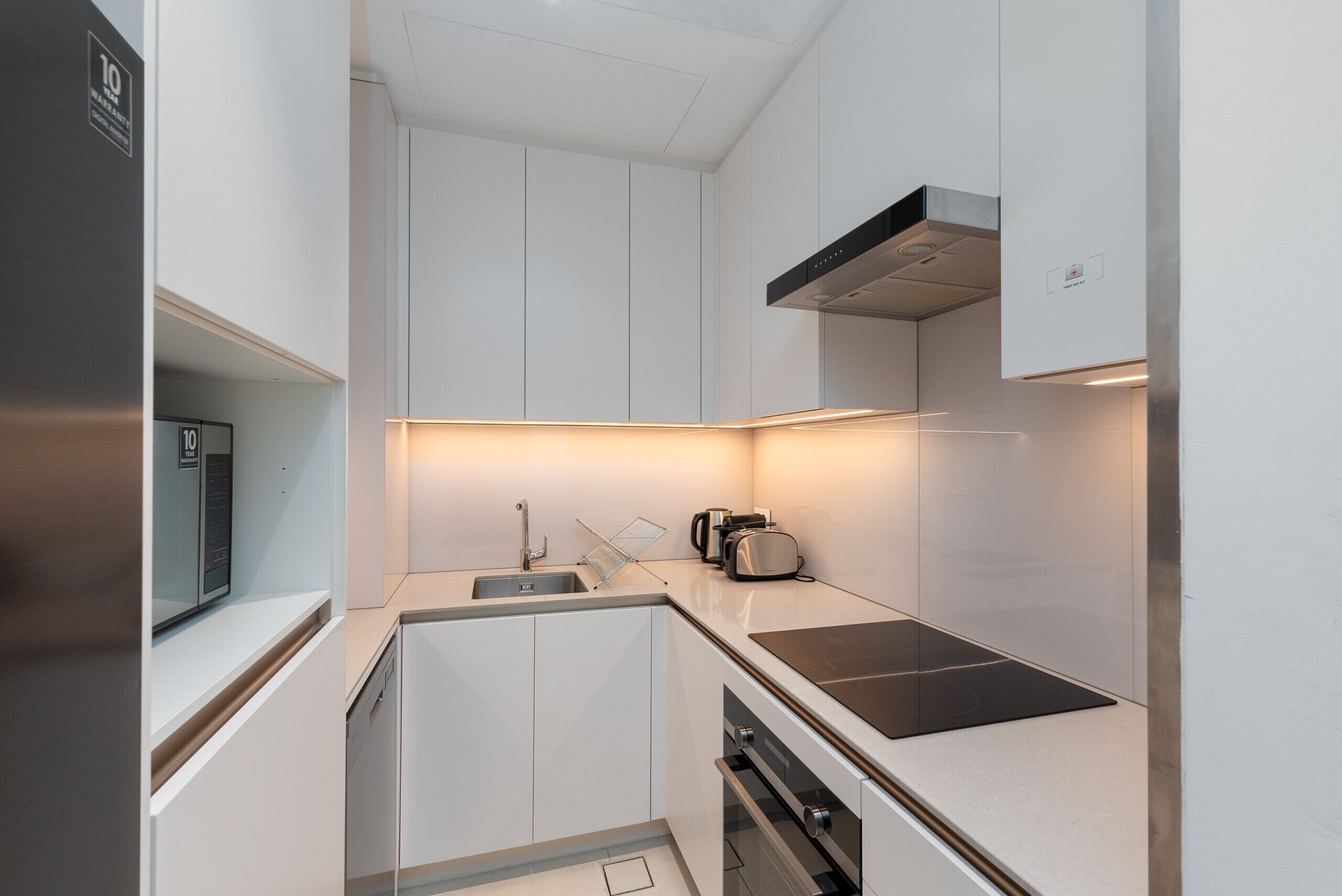 Coffee/tea maker, fridge, microwave, oven