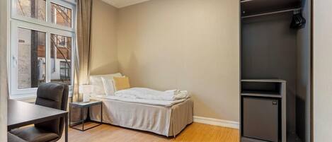 Desk, laptop workspace, free WiFi, bed sheets