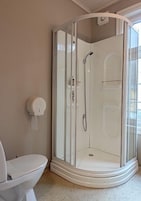 Shower, towels, soap, toilet paper