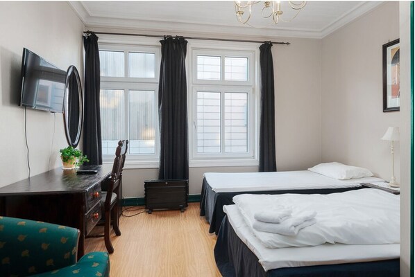 Desk, laptop workspace, free WiFi, bed sheets