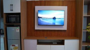 Classic Apartment | Living area | 55-inch Smart TV with cable channels, Netflix, streaming services