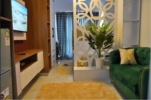Classic Apartment | Living area | 55-inch Smart TV with cable channels, Netflix, streaming services - Smart Homes - Elysian Escape (Nairobi)