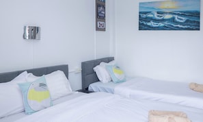 Comfort Triple Room, Balcony, City View | Down comforters, in-room safe, blackout drapes, free WiFi