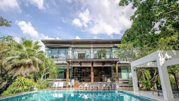 A modern two-story building with a swimming pool in front. - Khaoyai Valley 2 (Pak Chong)