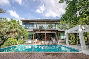 A modern two-story building with a swimming pool in front. - Khaoyai Valley 2 (Pak Chong)