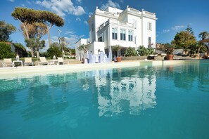 Outdoor pool, pool umbrellas, sun loungers