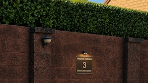 A wall with a sign indicating private parking, number 3, at Brayland Court. - Justaura Retreat Cosy Barn in Quiet Private Area (Lincoln)