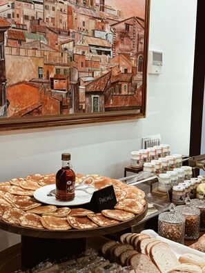 A breakfast buffet with pancakes, syrup, and various spreads. - Residenza Imperiale - Luxury Guest House (Rome)