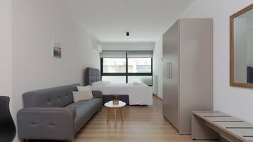 Laptop workspace, blackout curtains, soundproofing, iron/ironing board