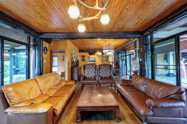 Villa, Mountain View | Living area | 50-inch TV with satellite channels