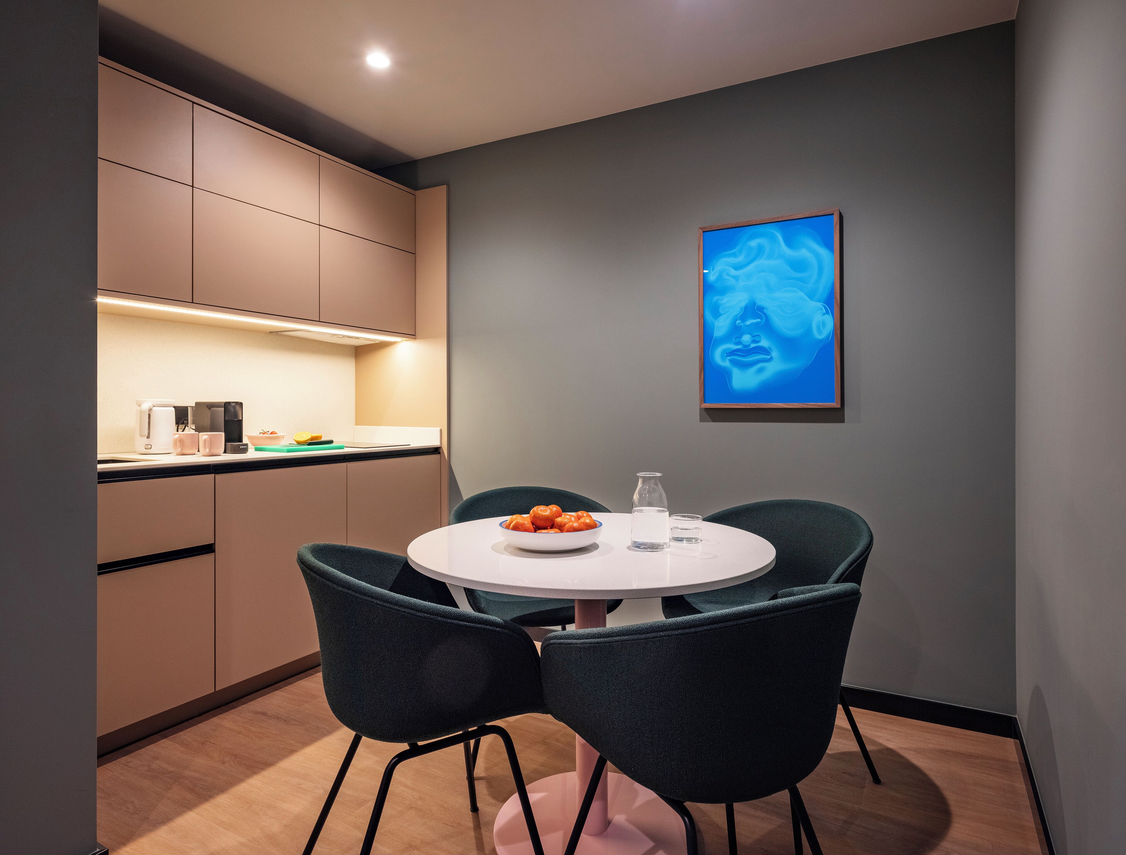 A modern kitchen with a dining area.