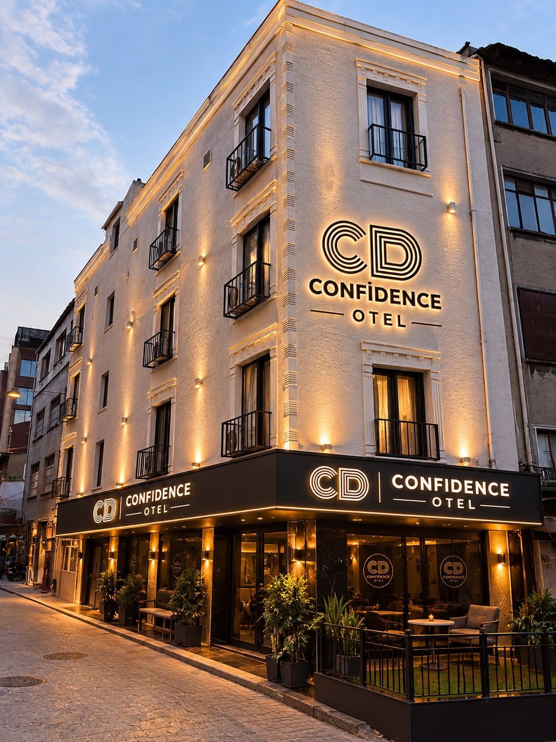A multi-story hotel with a prominent sign reading 'CD Confidence Hotel.'