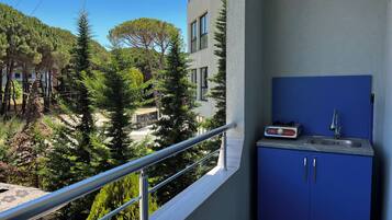 Triple Room, Garden View | Private kitchen | Fridge, stovetop, cookware/dishes/utensils