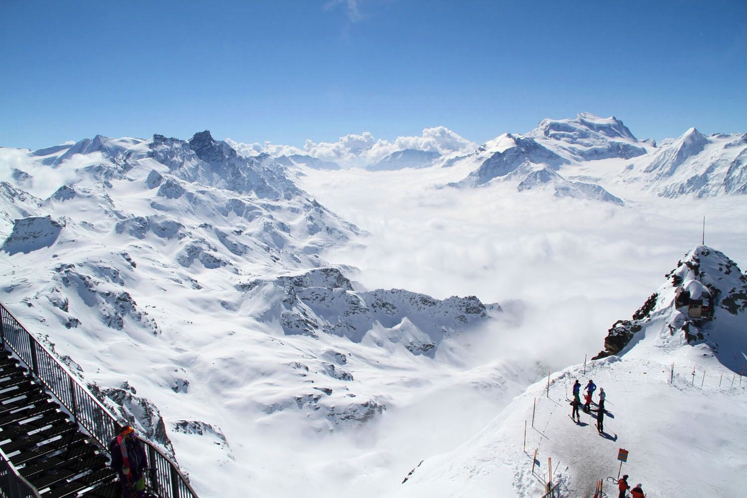 A snow-covered mountain landscape with a clear sky.
