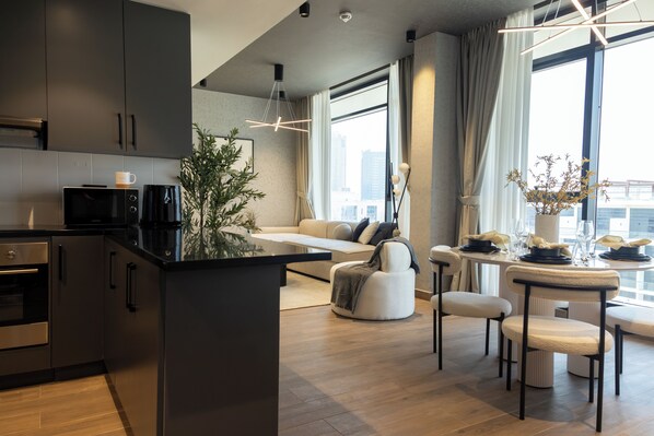 Deluxe Apartment, City View | Private kitchen | Microwave, oven, stovetop, cookware/dishes/utensils - WelHome - LOCI Residences (Dubai)