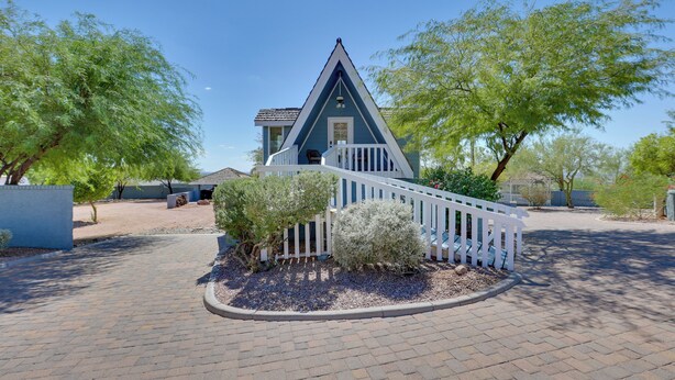 A blue house with a white porch and a triangular roof. - A-frame w/ Patio & Mtn Views: Arizona Retreat (Apache Junction)