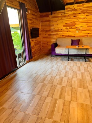 Suite Deluxe, vue jardin | Coin séjour