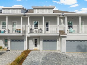 A two-story residential building with a front entrance, two balconies, and a garage. - Book 3 Nights & Get 1 Free/See Description*Near 30A* 2 King Suites*Pool & Beach (Santa Rosa Beach)